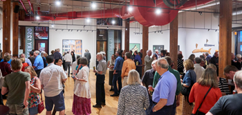 crowded indoor art exhibition